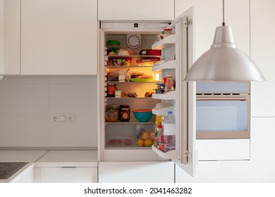 Open Fridge In The Kitchen. House Organization. Modern Interior.