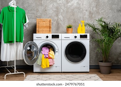 Open Front Loading Washing Machine With Colorful Clothes