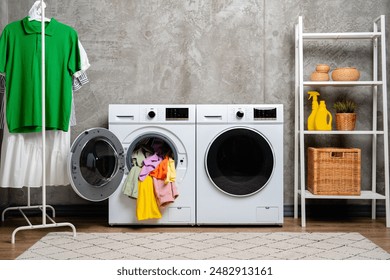 Open Front Loading Washing Machine With Colorful Clothes