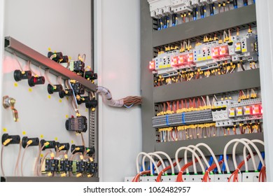 An Open Fuse Box Is On The Wall In The Basement. High Voltage Electrical Control Panel. Iron Electric Box