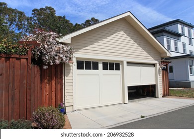 Open garage door in suburban house 