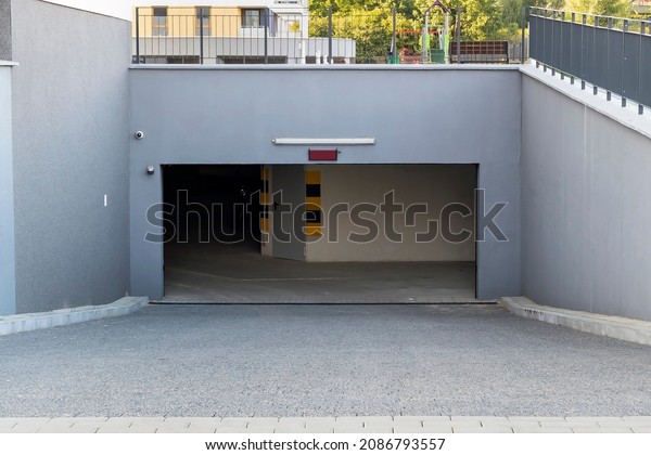 Open\
garage gate in the modern residential\
building