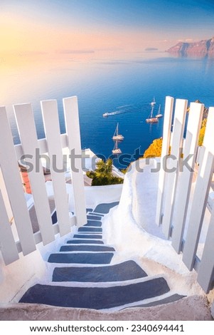 Open Gate to Paradise. Santorini, Greece. White architecture, open doors and steps to the blue sea of Santorini. Holidays in Greece, Santorini.