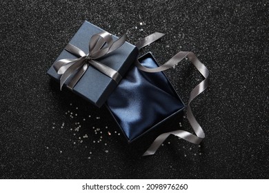 Open Gift Box On Dark Background, Top View