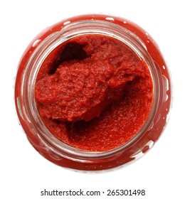 Open Glass Jar Of Tomato Paste. Isolated From Above.