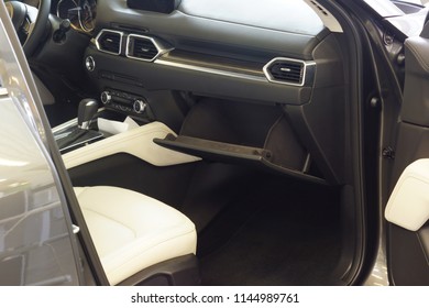 An Open Glove Box In The Interior Of The Car.