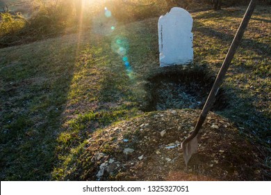 Open Grave With Shovel