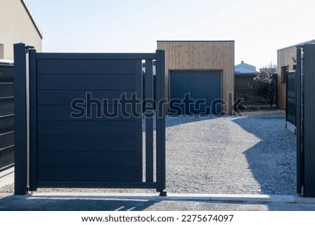 open grey double portal large metal gate high gray on suburb street house garage door