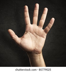 open hand against a grunge background