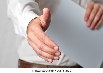 Open Handshake And Paperwork Pose Conveying Job Interview Or Acceptance