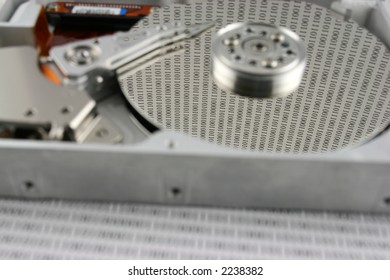 An open Hard disk with binary numbers on the platter  shallow  DOF