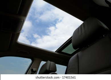 The Open Hatch On A Roof Of The Modern Car