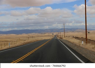 Open highway through the dry, open plains of California's Central Coast.