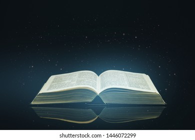 Open Holy Bible on a black glass table dark background - Shutterstock ID 1446072299