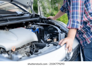 Open hood mechanic engine system to check and repair damage car crash.