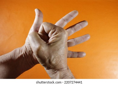 The Open Human Hand Symbolizes Our Intelligence, While The Closed Fist In His Palm Symbolizes Our Strength, It Forms A Gesticulated Design Of Demonstration With An Orange Background