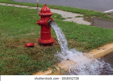 Open industrial fire hydrant being sprayed strong water
