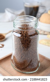 Open Jar Of Instant Coffee On White Table