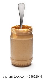 An open  jar of peanut butter with a spoon