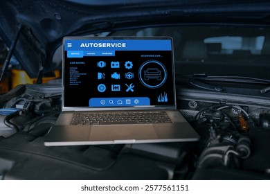 Open laptop displaying autoservice diagnostic software on a car engine, representing advanced vehicle maintenance, repair, and modern automotive technology