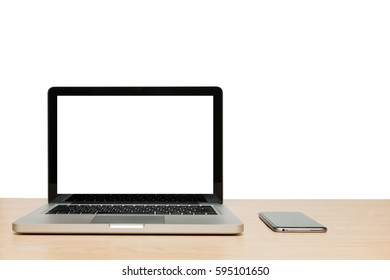 Open Laptop With Isolated White Screen And Mobile Phone On Wooden Desk