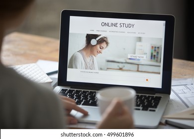 Open Laptop On The Desk With A Title Online Study On The Screen. Education Concept Photo, View Over The Shoulder, Close-up