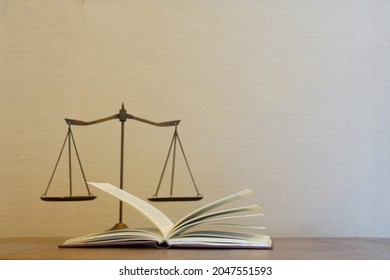 Open Law Book With Blur Justice Scale And Blank Space Gradient White And Brown Wall For Design Lagal Background Concept