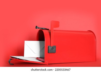 Open Letter Box With Envelopes On Red Background