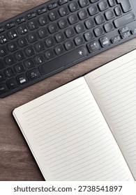 Open Lined Notebook With Keyboard On Wooden Desk Business Planning Concept