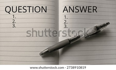 Open Lined Notebook Titled Question and Answer with Sleek Pen| A minimalist black and white composition showing a notepad prepared for structured inquiries, interviews, or educational testing sessions.