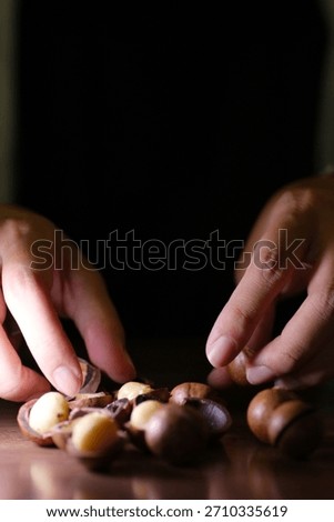 Open the macadamia nut using specialized metal key. Just slit in the shell and twist 