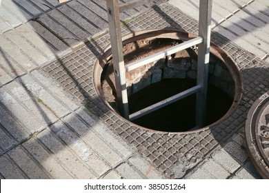 Open Manhole With Ladder 