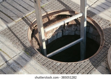 Open Manhole With Ladder 