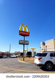 Open McDonald's - Standalone Sign During Daylight Hours With Shamrock Shake Advertisement (Cheyenne, Wyoming, USA) - 03\04\2020