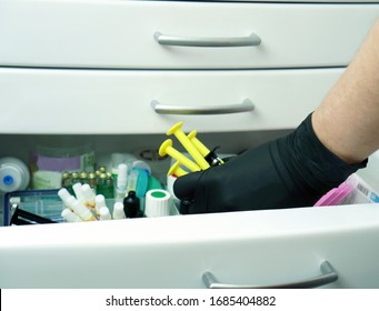 Open Medicine Cabinet In A Medical Clinic.Vaccine Against The Virus. The Cure For The Disease. Search For The Necessary Medicines In The Medical Cabinet