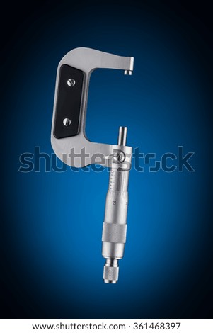 Open micrometer side view isolated on blue background