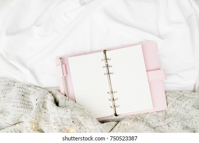 Open Mockup Planner On Bed With Warm Plaid. Copy Space. Flat Lay, Top View