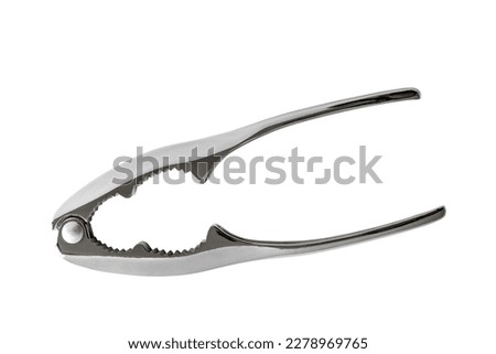 Open modern iron nutcracker on white background