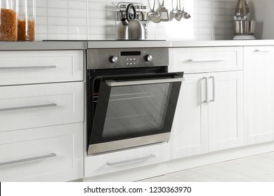 Open modern oven built in kitchen furniture - Shutterstock ID 1230363970