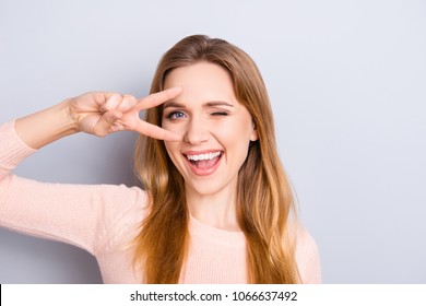 Open mouth people person entertainment concept. Close up portrait of playful excited funny joyful positive optimistic with toothy smile girl showing v-sign isolated on gray background copy-space