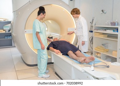 Open Mri Scanner With Man In 40s Undergoing Test