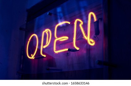 Open. Neon Sign On The Door. Invitation To A Night Club.