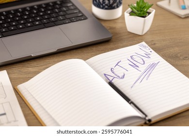 Open notebook with Act Now written. A concept of motivation, urgency, and success for goal achievement