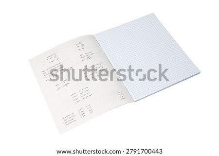 open notebook in algebra and mathematics with a list of trigonometric formulas of trigonometry sine cosine tangent functions on the left page and a blank checkered sheet on a white background