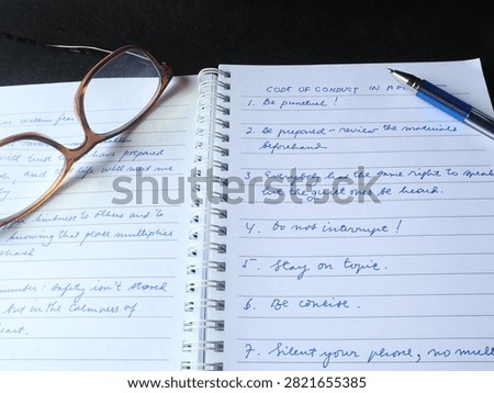 An open notebook with cursive handwriting	