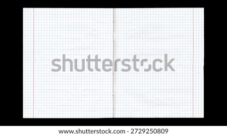 Open notebook graph paper spread on black background, clean blank pages