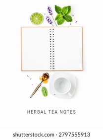 Open notebook with lavender, mint, lime, honey and teacup isolated on white background. Herbal tea concept. Clean branding and modern layout. Flat lay, top view