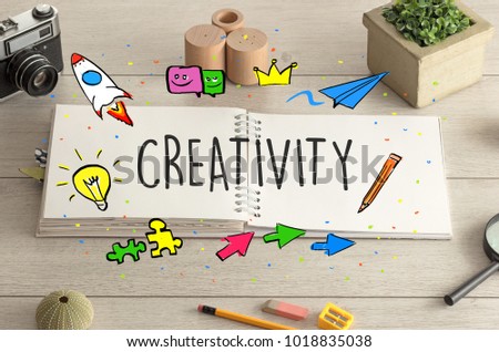 Open notebook on the floor with instruments on the floor and creativity, design concept