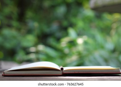 The Open Notebook And The Pencil With Nature Background, In Concept Of Education, Business,  Nature