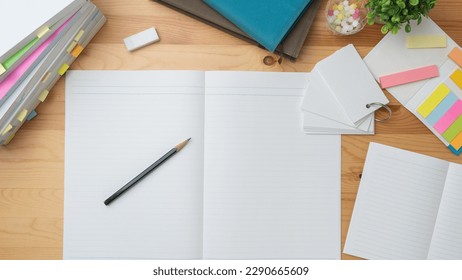 Open notebook and textbook. image of study.